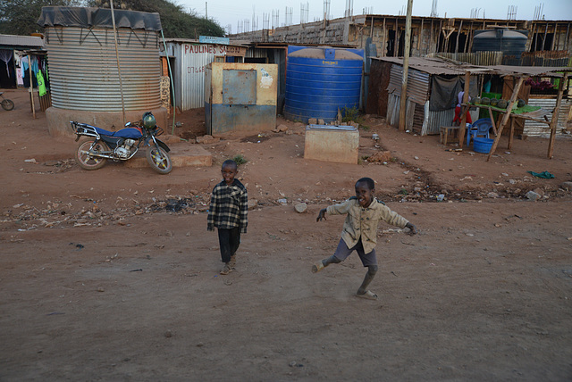 It's getting dark, but children are still around.