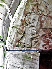 tissington church, derbs (30)adam? arms akimbo on the early c12 tympanum