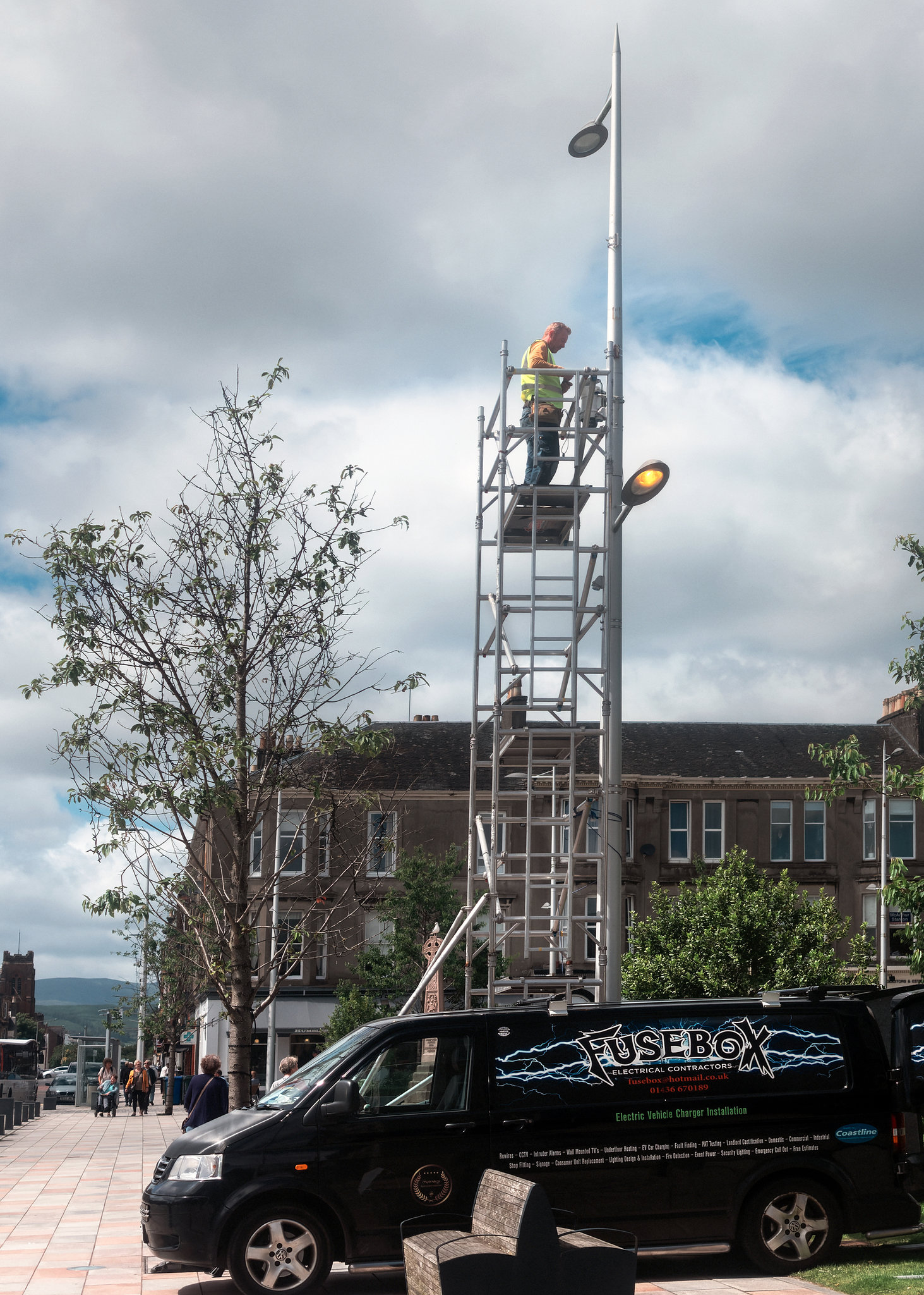 Man Working on a Lamp Post