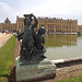 Two Children and a Cupid Statue with the Palace of Versailles, June 2013