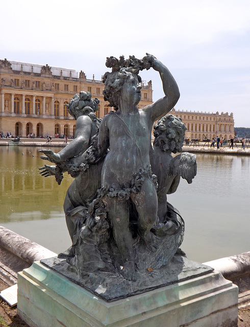 Two Children and a Cupid Statue in the Gardens of Versailles, June 2013