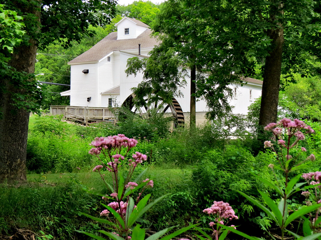 The mill on a partly cloudy day.