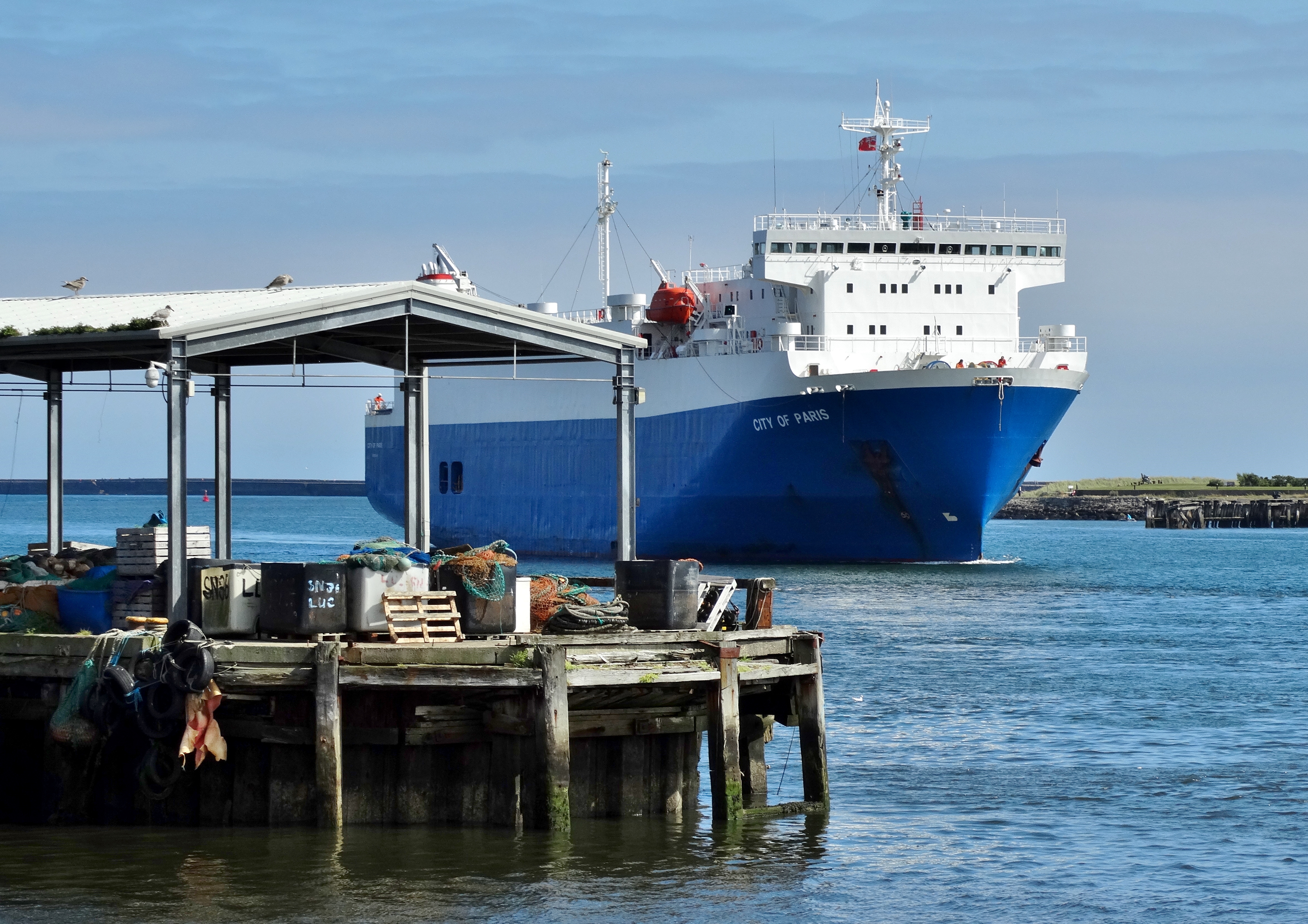 A car ferry gliding past the Fishquay