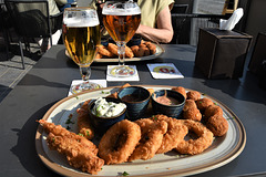Table with fried fish and two beers!