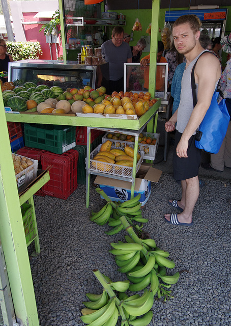 Grumpy man in a fruit shop