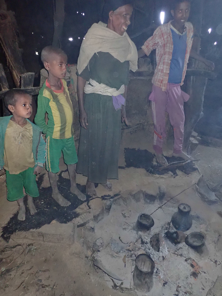 Being greeted by a family in their house near Aina Amba