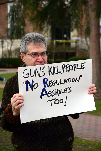 Proud of his clever sign