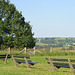 You  can enjoy a beautiful tree(bench on the left) a beautiful landscape(bench in the middle) or a waste bucket( bench on the right----SIT DOWN---