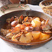 Clams with pork and potatoes in cataplana.