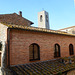 Italy, San Gimignano, Upper Levels of Museum 1300 and Bell Tower of Duomo di Santa Maria Assunta