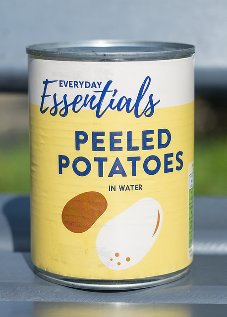A Can of Peeled Potatoes on a Bench
