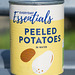 A Can of Peeled Potatoes on a Bench