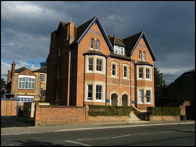 brick house in a grey sky