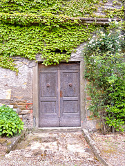 Greve in Chianti, Tuscany, Door to the wine cellar of Savignola Paolina Winery - 052814-009