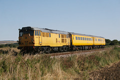 Network Rail class 31 No. 31233 pushing its train 1Q14 Neville Hill to Scarborough at Willerby Carr crossing 7th August 2014