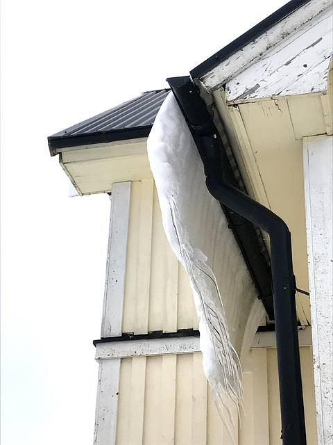 snow slipping off rooves