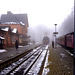 A train emerges from the mist into  Drei Annen Hohne station