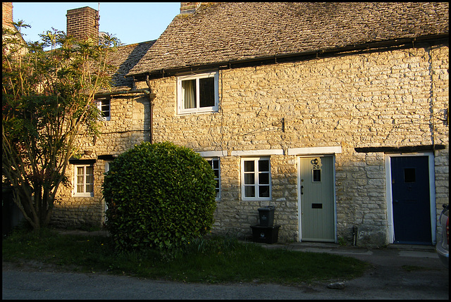 sunlight on stone cottage