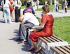 Lady in red eating ice cream in high heels / Dame en rouge et en talons hauts dégustant un cornet de crème glacée