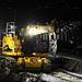 Excavator at work at night..
