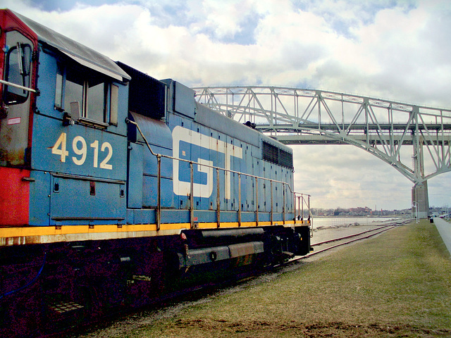 Three methods of transportation: by rail, on the bridge and on the water.