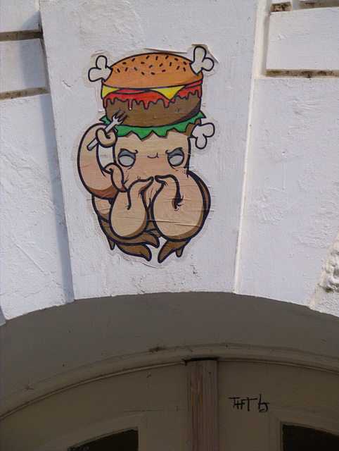 Paste-Up: Tintenfisch verzehrt einen Burger