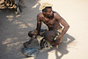 Namibia, An Ancient Blacksmith in the Damara Living Museum Works with a Modern Iron Rebar