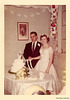 Cutting the Cake — Smiling Bride and Distracted Groom