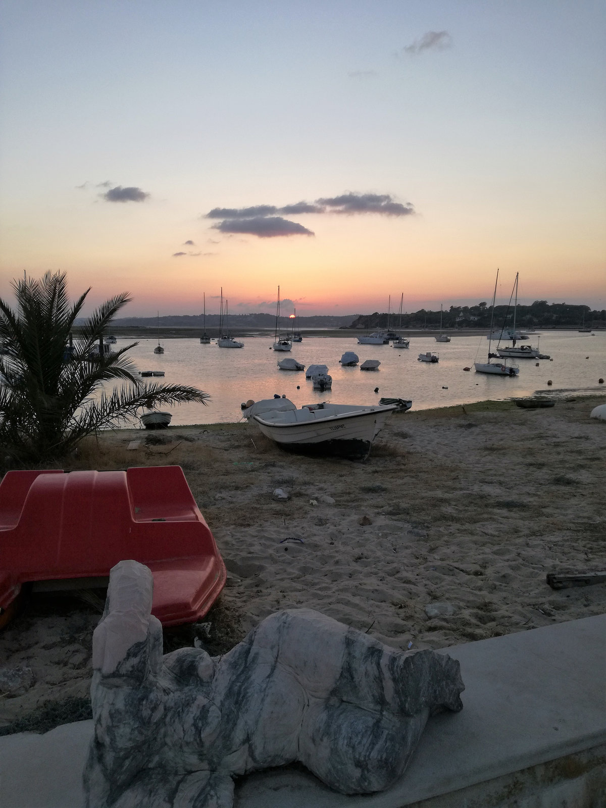 The stone mermaid will fall asleep on the Alvor Beach parapet