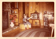 Boy with Toy Guitar and TV