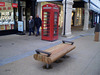 Bench and telephone booth.