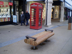 Bench and telephone booth.