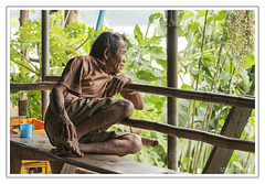 Old man in Ban Xang Hai looking at the Mekong River