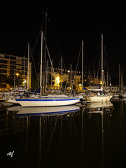 sailboats in the dark