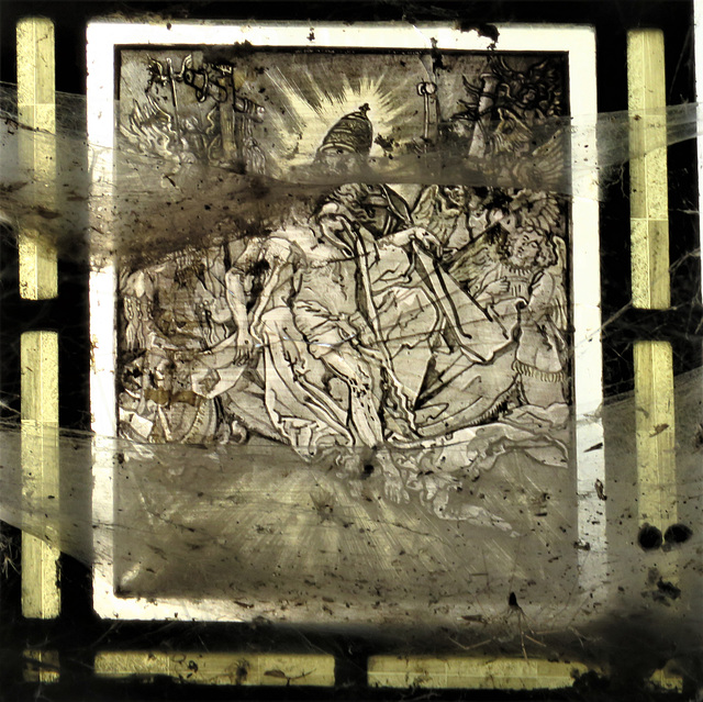 angels hold passion symbols around a dead christ on what appears to be c17 flemish glass in the tower st peter's church, canterbury, kent   (3)