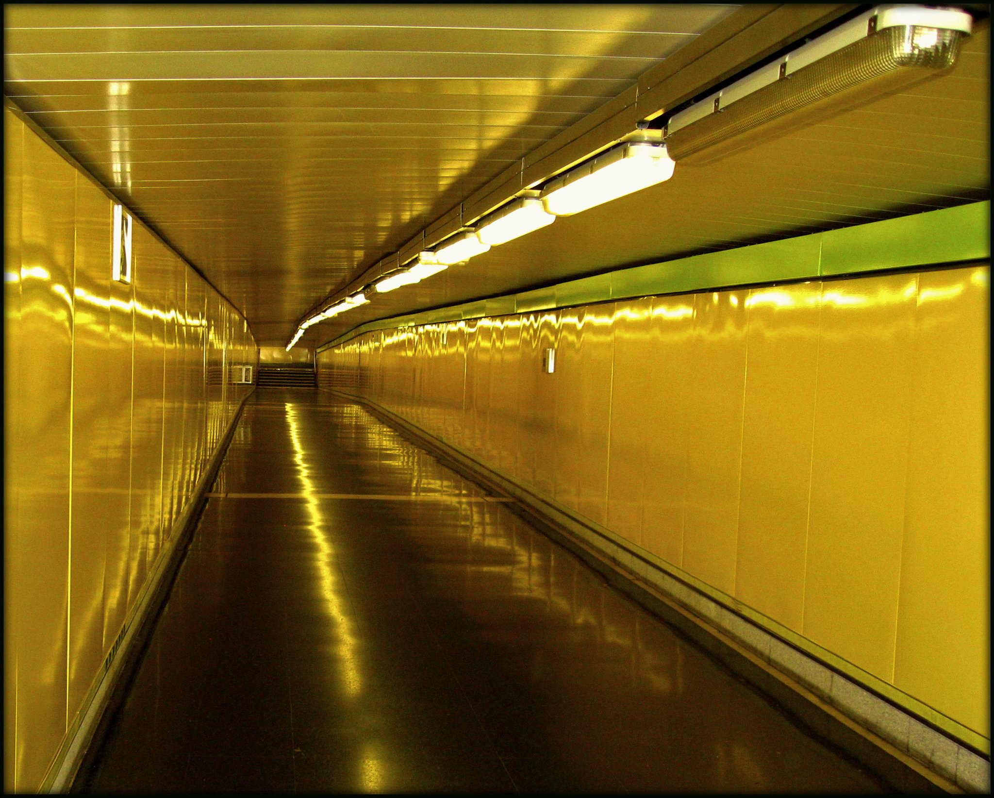 This is only a short stretch of a very long walkway linking two lines at Nuñez de Balboa metro station, Madrid. (I waited two whole days to get a shot without people!)