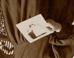 Girl Holding Photo and Standing on Chair (Detail)