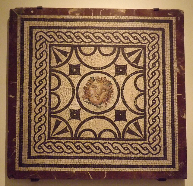 Mosaic Emblema with a Medusa Head from the House of the Vestals in Pompeii in the Naples Archaeological Museum, July 2012