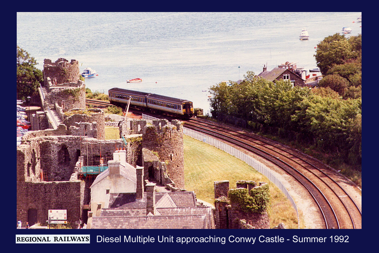 BR DMU approaching Conwy Castle 1992