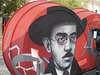 Portrait of Fernando Pessoa, painted on sidewalk ticket office.