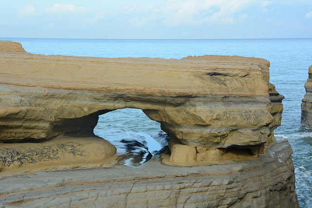 Greece, Northern Kerkyra (Corfu),  Looking through the Hole in the Coastal Sandstone Cliff