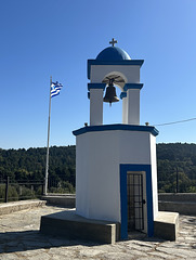 Bell tower and greek flag.