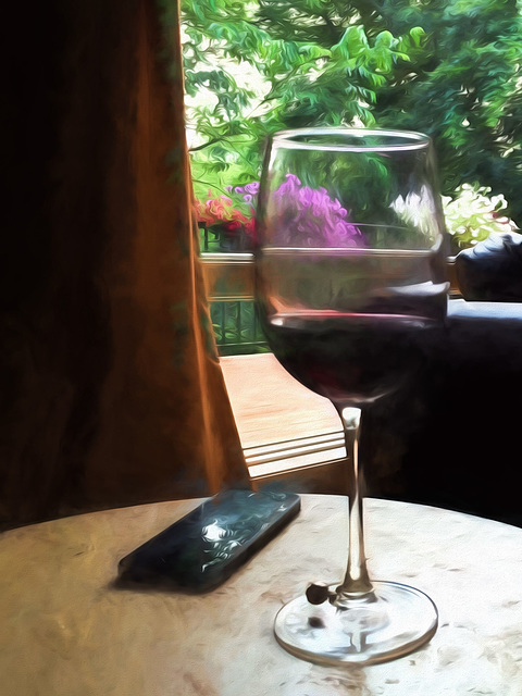 still life with wine glass and cell phone