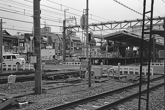 Railroad crossing by a station