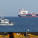 University Royal Naval Unit HMS Archer (P264) passes in front of oil tanker Stena Penguin