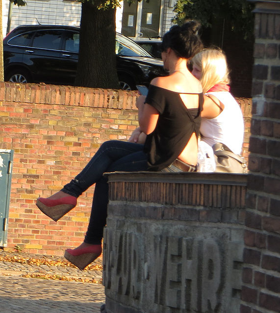 sitting on a wall