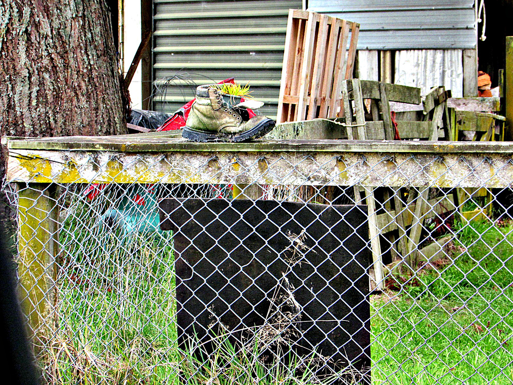 A Boot on a Fence.