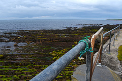 Fence with blue rope at  john o groats