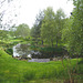 Pond weed-clearing in operation