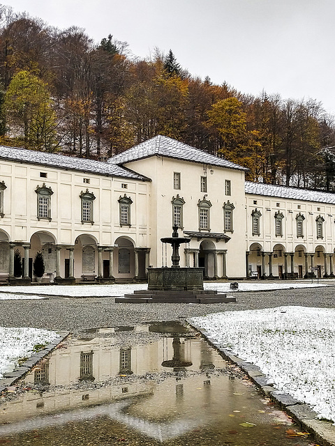 The first snow in Oropa (Biella) - The reflex of the fountain